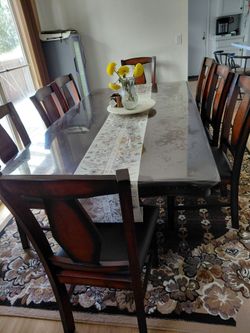 Dinning table with 8 chairs (Barely used)