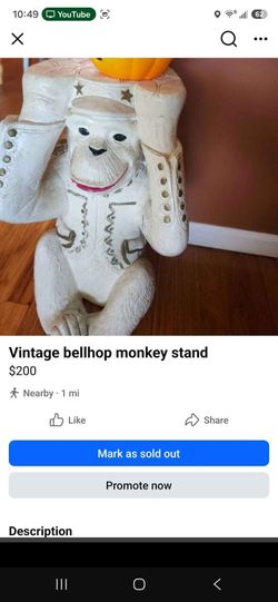 Vintage bellhop monkey stand