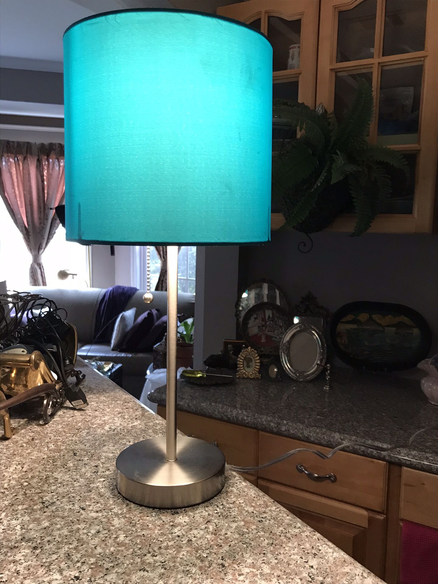 Set of sleek chrome based bedside lamps w/ aqua colored shades