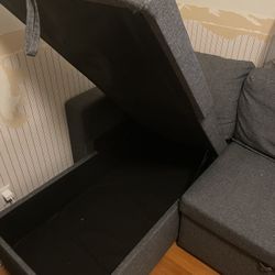 Grey convertible sleeper couch with chaise