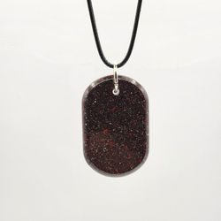 Stardust I Orgonite Pendant, Provides EMF Protection, And  Balance.


Contains:

Red jasper, black obsidian, metal, and resin.


"Embark on a journey 