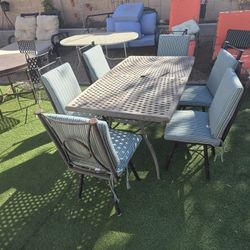 $400 ARIZONA IRON 6 SWIVEL CHAIRS WITH BIG TABLE AND SUNBRELLA CUSHIONS 