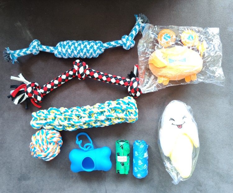 NEW: 9 Piece Set of Dog Toys, Poop Bags and Dispenser with Clip