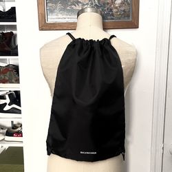 Balenciaga drawstring backpack and/or dust bag. Brand new never used. Lightweight and simple, it's an easy way to store and carry the gear you need to