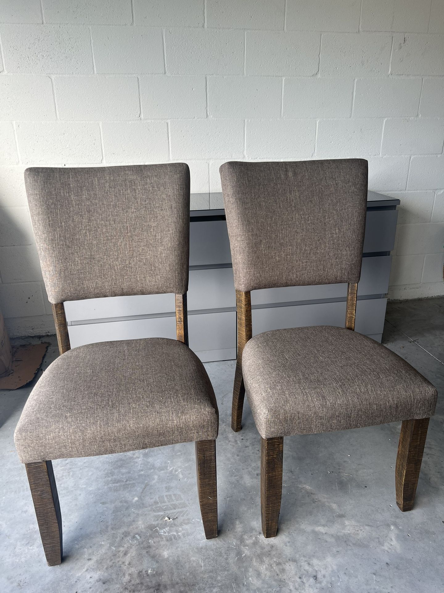 Two Chairs With Fabric Cushions And Wooden Legs