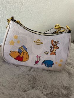 Winnie the pooh shoulder purse.