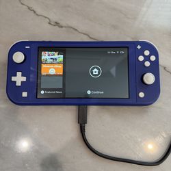 Nintendo Switch Lite (Blue) + Super Smash Bros – Great Condition