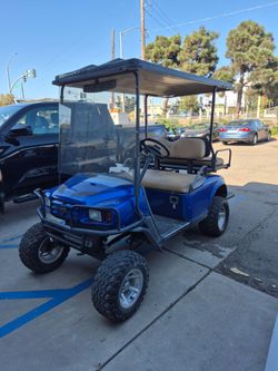 Blue Lifted Golf Cart with Canopy