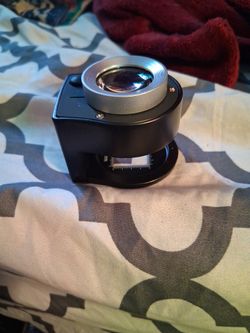 Coin Vier And Measurer With Light And Black Light