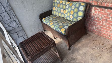 Wicker brown patio outdoor loveseat or sofa and table