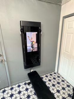 Wall mounted Tonal total workout system