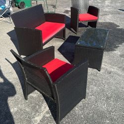 Costway 4 -Piece Rattan Patio Conversation Set with Red Cushions