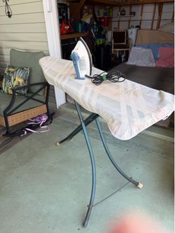 Ironing board with iron included