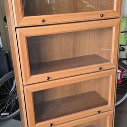 Wooden display cabinet with glass doors