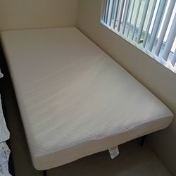 Twin memory foam mattress with frame....( Brand New)