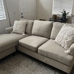Cream White Emery Chiffon 84” Sectional Sofa with Reversible Chaise by Living Spaces