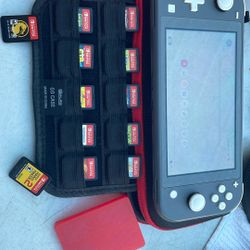 Nintendo switch lite with games and case and game holders