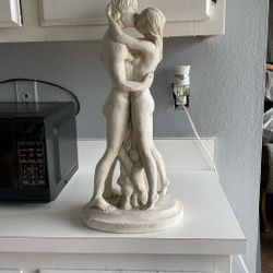 Sculpture Of Kissing Couple.