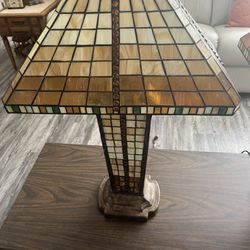 Stain glass lamp. Lights up in the middle as well. It is well-built. See description for all details
