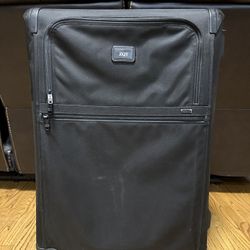 Used Tumi Alpha 2 suitcase. Great for extended travel or international flights. Has some cosmetic wear but still fully functional. Retail MSRP is arou