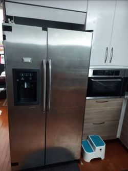 Free GE Side-By-Side Refrigerator - 24.9 Cu. Ft. Capacity