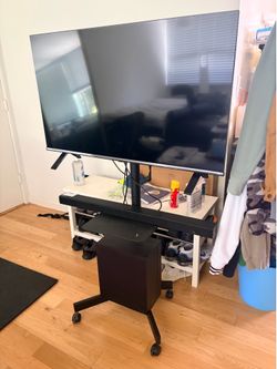 Tv, sound bar with subwoofer and rolling tv rack/stand