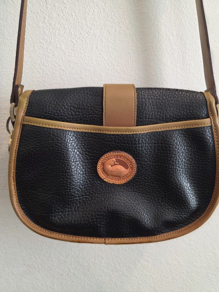 Vintage Dooney & Bourke All Weather Leather (AWL) Crossbody / Saddle Bag in black pebbled leather with tan trim