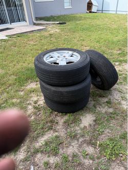 For sale  sets of rims and tires hold air but need tires jeep grand Cherokee