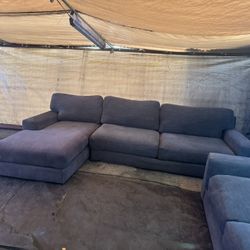 Gray couch with matching loveseat oversize it’s not small. They are the same color. 
