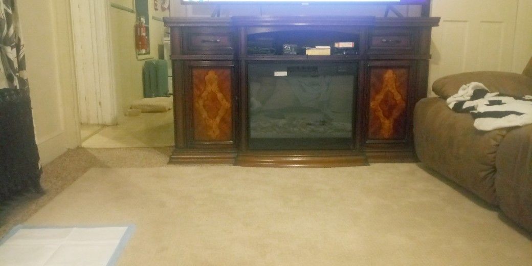 FIREPLACE. AND. BRAND NEW. 70. SAMSUNG. 4K. SMART TV.. STILL IN THE BOX NEVER OPEN