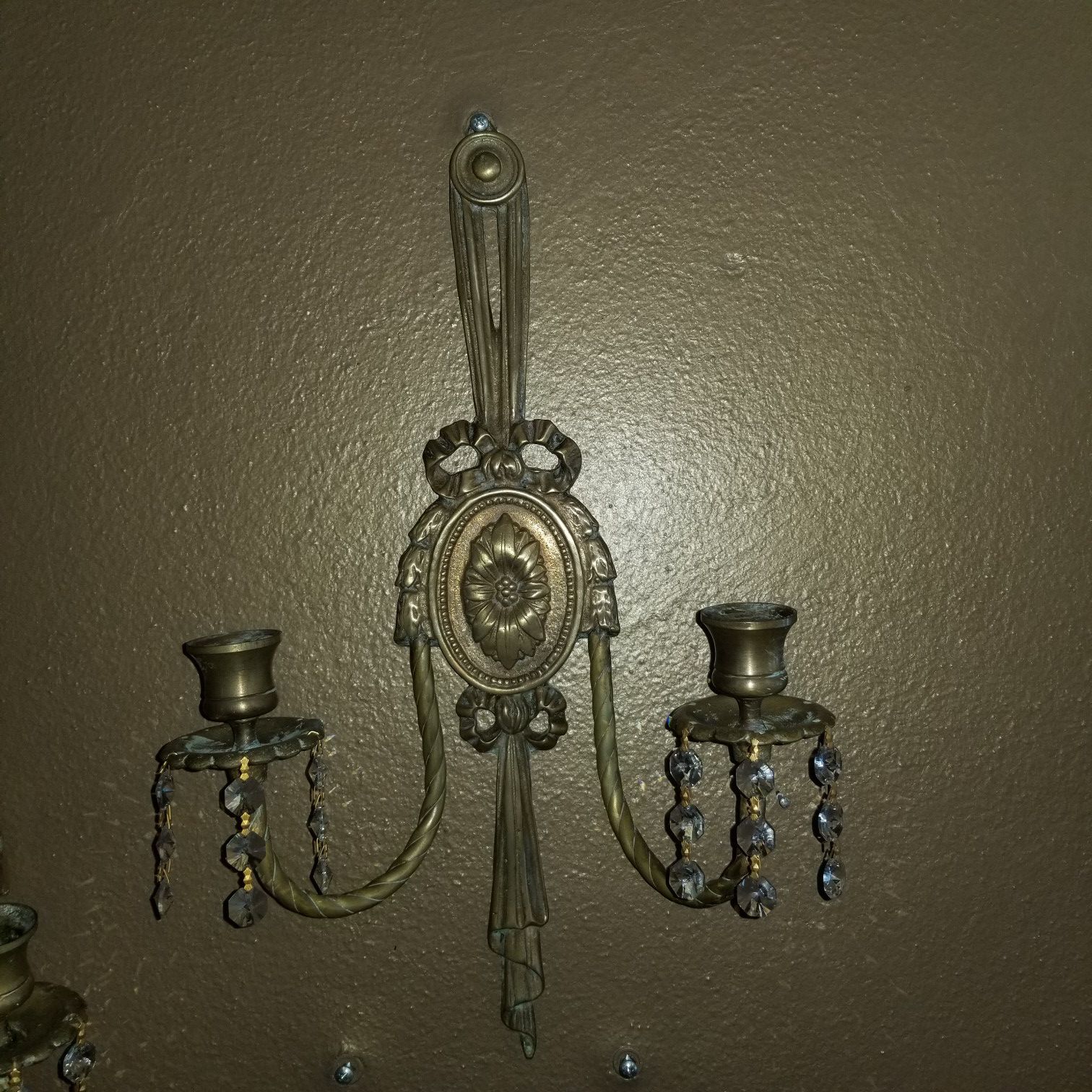 Two antique brass crystal wall sconces