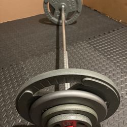 BRAND NEW Standard: 6 ft Steel Barbell with pairs of 45s 25s 10s and 5s. Total: 190 lbs