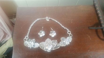 23 in. Necklace and earrings silver color.