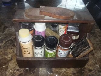 Antique shoe polish kit with old collectible cans and brushes