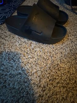 Black Nike calm slides