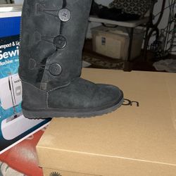 Uggs.  One Black Size 7. One Tan Size 6