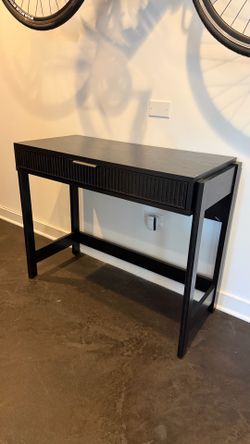 Modern black writing desk with drawer