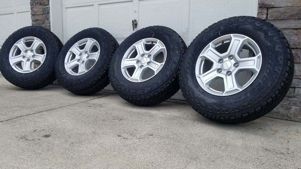 Brand new 2020 jeep wrangler gladiator wheels with bridgestone all terrian, 245 75 r17