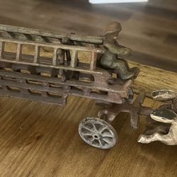 Antique cast iron horse drawn fire fighters with ladders. Metal art, toy, Christmas