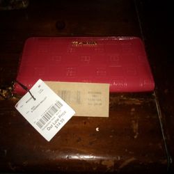 Steve Madden wallet with strap handle.