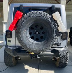 Spare tire rotopax fuel can and mount
