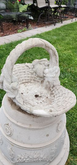 Cast stone concrete garden basket.