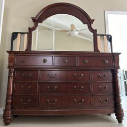 Like new large dresser with mirror with a free queen bed frame 