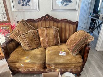 Victorian carved wood sofa and loveseat