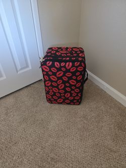 Suitcase, not a rolling travel bag.