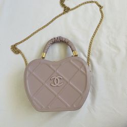 In 2024, the shoulder bag, bag for women, metal chain decoration design, new fashion bag is suitable for shopping. It has two straps and is purple in 