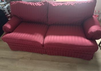Burgundy sofa comes with 2 pillows