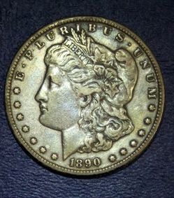1890 “CC” AU Morgan Silver Dollar With Toning 