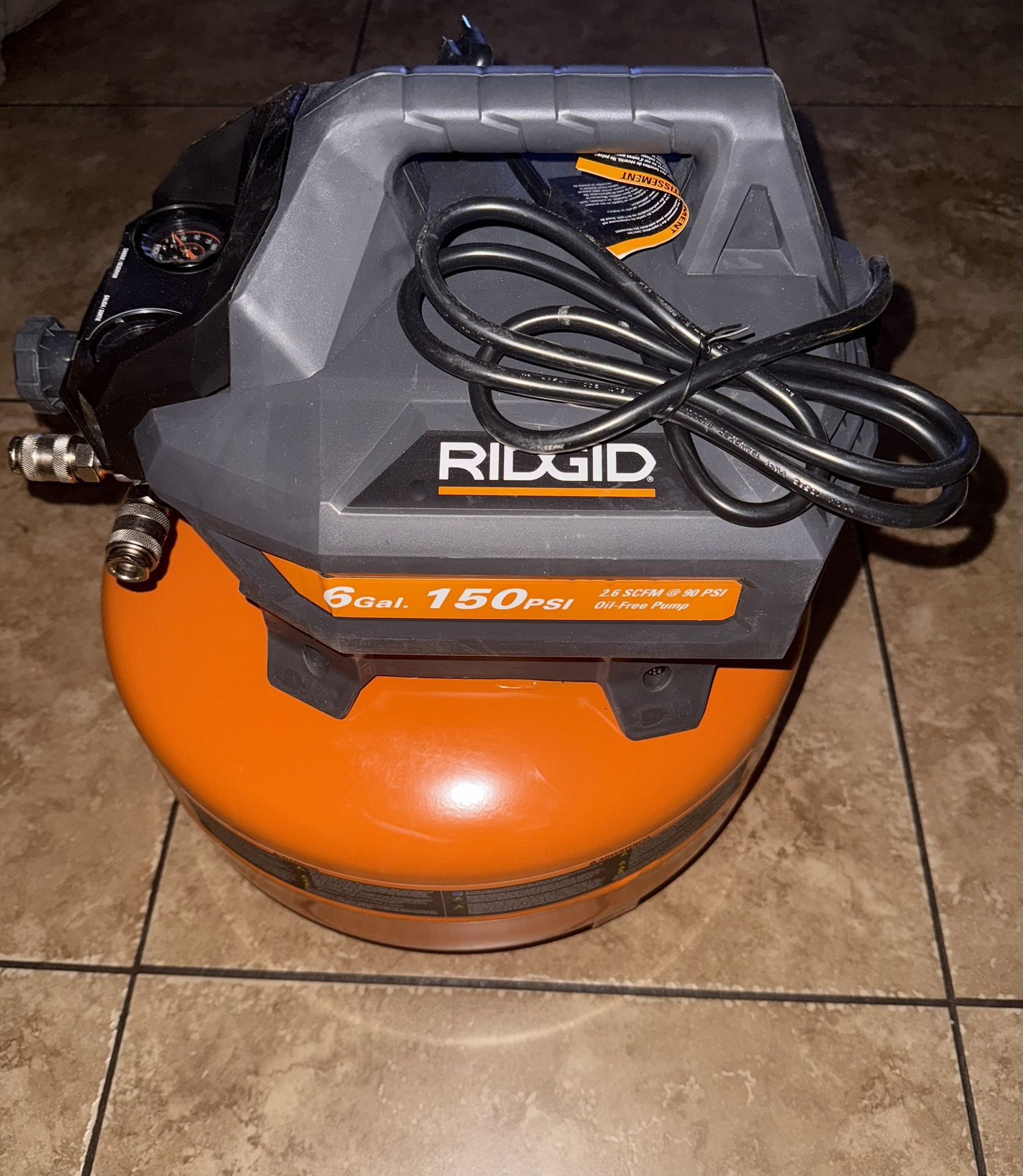 RIDGID 6 Gal. 150 PSI Portable Electric Oil-Free Jobsite Pancake Air Compressor with Dual Pressure Gauges and 2-Quick Couplers