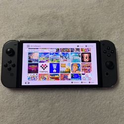 NINTENDO SWITCH OLED with 125 SWITCH GAMES MARIO KART,MARIO PARTY,POKEMON,ZELDA